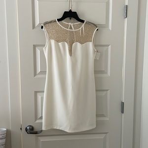 White mini dress with gold detailing